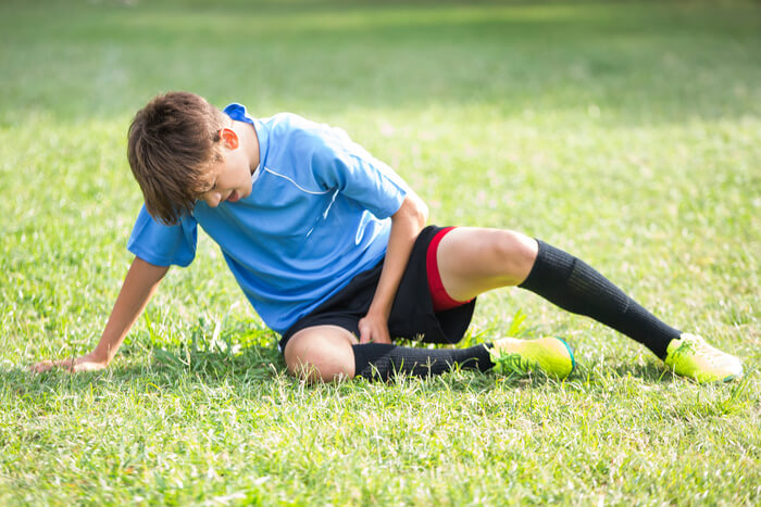 Child playing sports outside