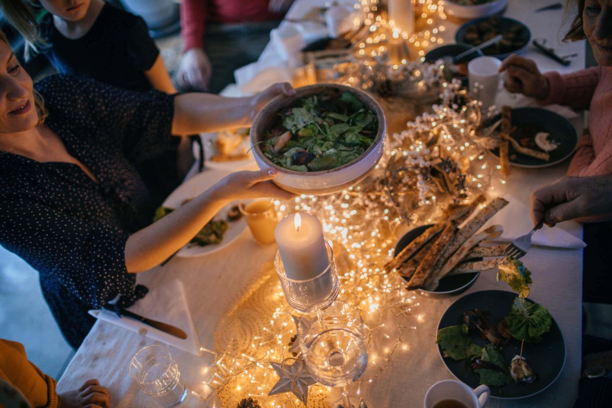 Passing food at holiday dinner